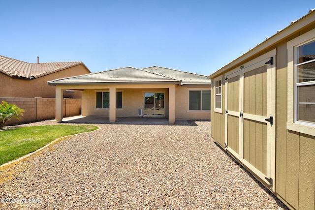 11710 W Boll Bloom Dr, Marana, AZ 85653 - back of house featuring a patio area, stucco siding, and a tiled roof