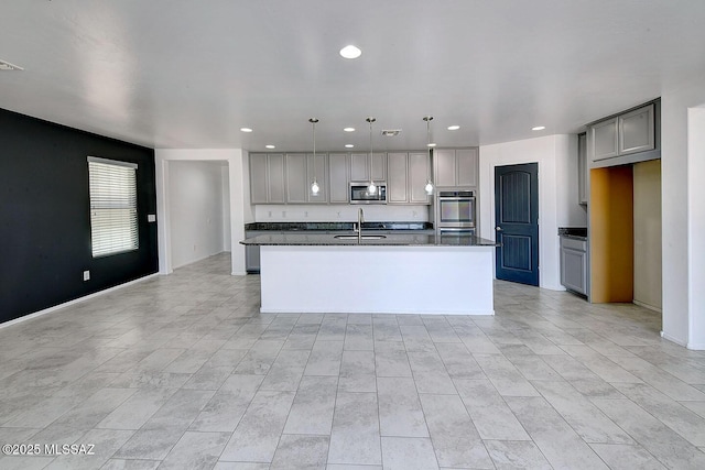 11710 W Boll Bloom Dr, Marana, AZ 85653 - kitchen featuring appliances with stainless steel finishes, dark countertops, gray cabinetry, a sink, and recessed lighting