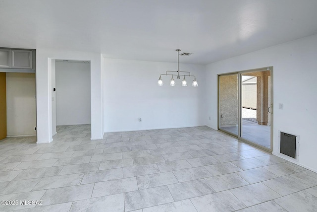 11710 W Boll Bloom Dr, Marana, AZ 85653 - spare room with a chandelier and heating unit