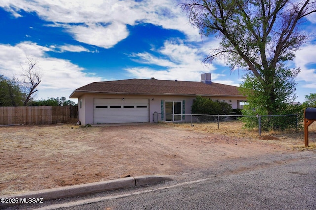 100 N Dale Rd, Pearce, AZ 85625 - view of front of property featuring driveway, an attached garage, and stucco siding