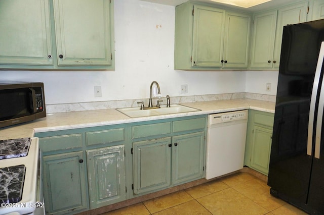 100 N Dale Rd, Pearce, AZ 85625 - kitchen with white appliances, a sink, green cabinetry, light tile patterned flooring, and light countertops