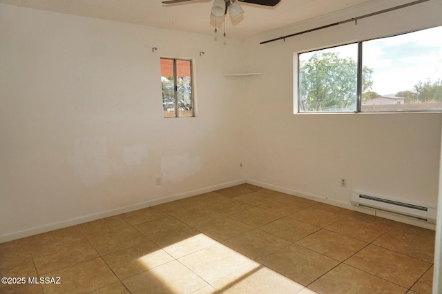 100 N Dale Rd, Pearce, AZ 85625 - empty room featuring a baseboard heating unit, ceiling fan, light tile patterned floors, and baseboards
