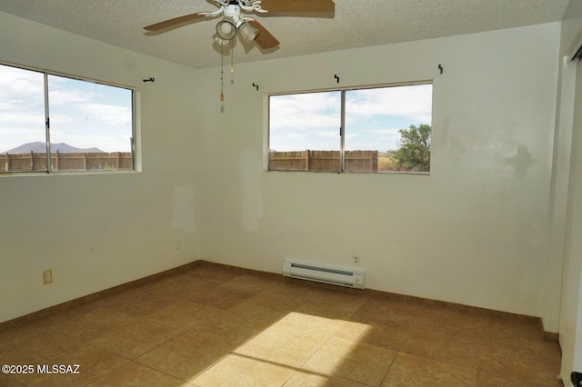 100 N Dale Rd, Pearce, AZ 85625 - empty room featuring baseboard heating, healthy amount of natural light, a ceiling fan, a textured ceiling, and baseboards