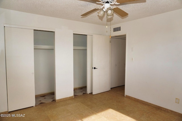 100 N Dale Rd, Pearce, AZ 85625 - unfurnished bedroom with multiple closets, a textured ceiling, and ceiling fan
