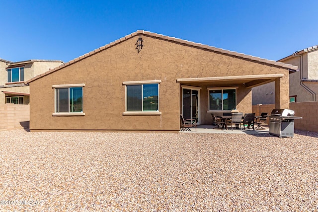 11815 N Silverscape Dr, Oro Valley, AZ 85737 - back of property featuring stucco siding and a patio