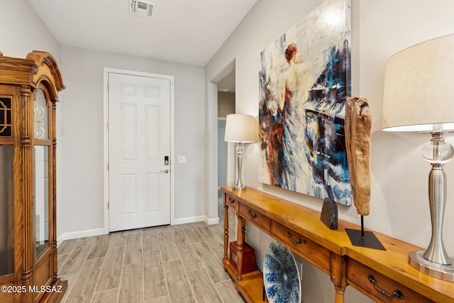 11815 N Silverscape Dr, Oro Valley, AZ 85737 - foyer entrance featuring light wood finished floors and baseboards