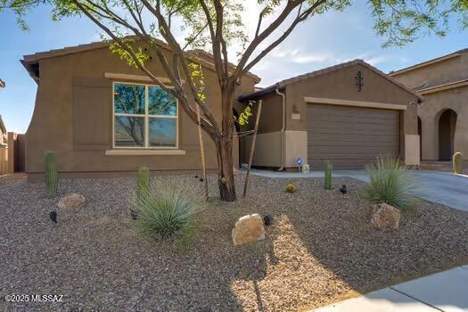 11815 N Silverscape Dr, Oro Valley, AZ 85737 - view of front facade featuring a garage, concrete driveway, and stucco siding