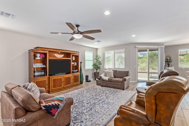 11815 N Silverscape Dr, Oro Valley, AZ 85737 - living area featuring ceiling fan, recessed lighting, wood finished floors, and baseboards