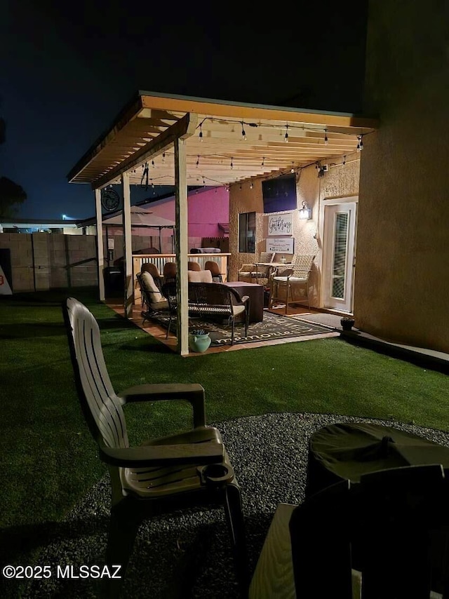 9650 N Gyor Pl, Tucson, AZ 85742 - yard at twilight featuring a patio area and outdoor lounge area