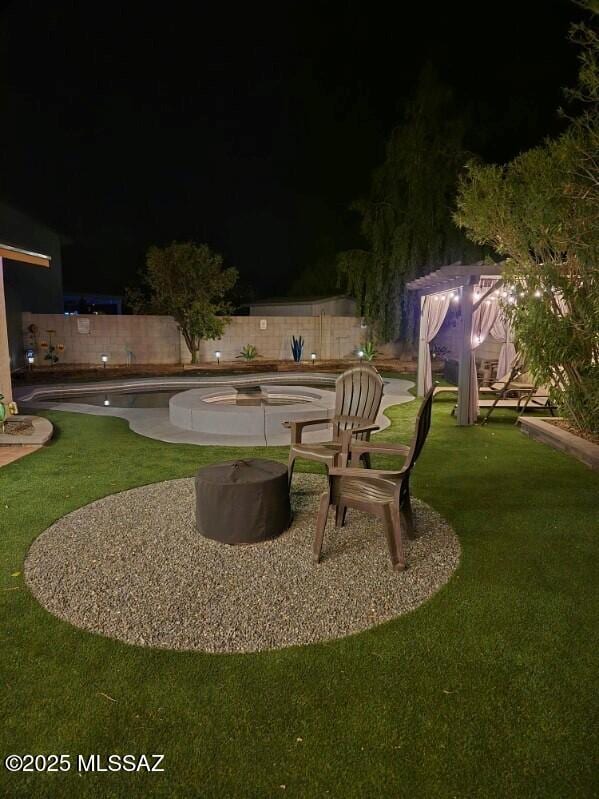 9650 N Gyor Pl, Tucson, AZ 85742 - yard at twilight featuring a patio
