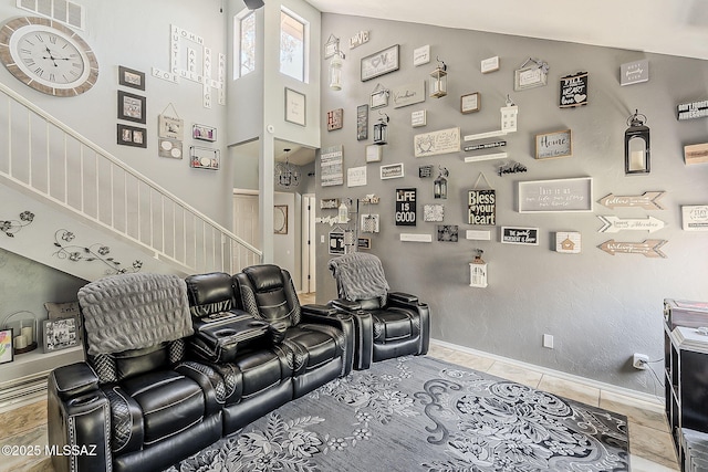 9650 N Gyor Pl, Tucson, AZ 85742 - tiled home theater room featuring high vaulted ceiling and baseboards