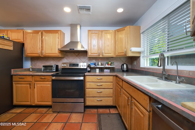 2931 N Mitch Dr, Tucson, AZ 85719 - kitchen featuring stainless steel appliances, wall chimney range hood, a sink, backsplash, and recessed lighting