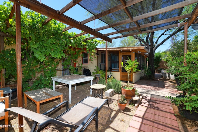 2931 N Mitch Dr, Tucson, AZ 85719 - view of patio featuring outdoor dining area and a pergola