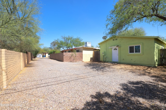 2931 N Mitch Dr, Tucson, AZ 85719 - back of house featuring stucco siding and driveway