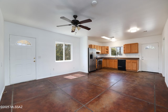 2931 N Mitch Dr, Tucson, AZ 85719 - kitchen featuring appliances with stainless steel finishes, under cabinet range hood, ceiling fan, baseboards, and concrete flooring