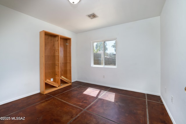 2931 N Mitch Dr, Tucson, AZ 85719 - unfurnished bedroom featuring baseboards and concrete flooring
