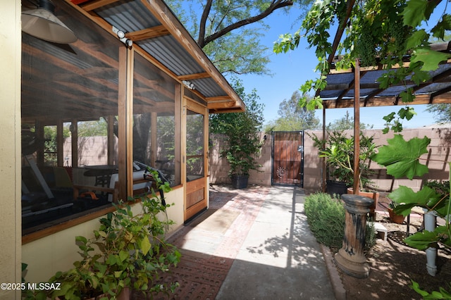 2931 N Mitch Dr, Tucson, AZ 85719 - view of patio / terrace with a sunroom and a gate