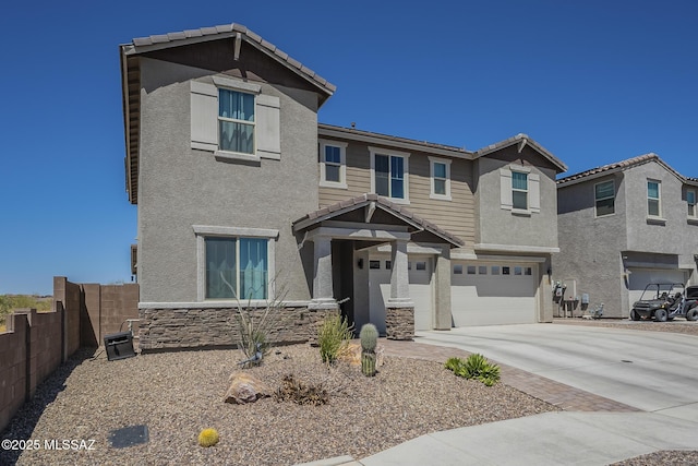 5550 S Sycamore Rim Trl, Tucson, AZ 85747 - view of front of house with concrete driveway, stucco siding, a garage, and stone siding