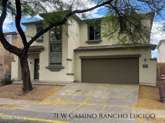71 W Camino Rancho Lucido, Sahuarita, AZ 85629 - view of front of property featuring an attached garage, stucco siding, and driveway