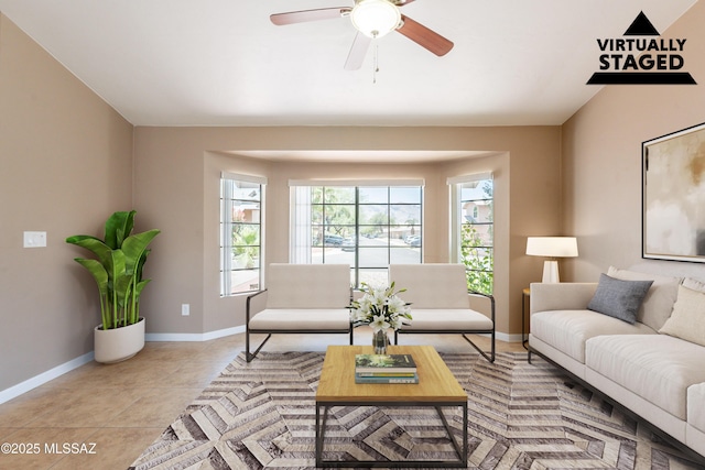 9701 N Camino Del Fierro, Tucson, AZ 85742 - living area with baseboards, ceiling fan, and light tile patterned floors
