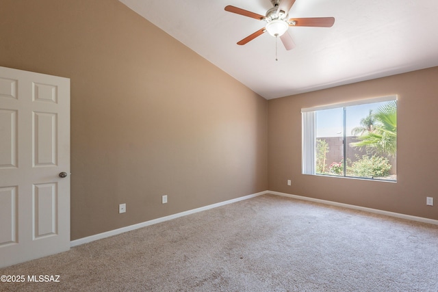 9701 N Camino Del Fierro, Tucson, AZ 85742 - spare room featuring carpet floors, ceiling fan, baseboards, and vaulted ceiling