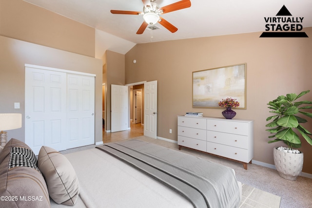 9701 N Camino Del Fierro, Tucson, AZ 85742 - bedroom with light colored carpet, baseboards, lofted ceiling, a closet, and a ceiling fan