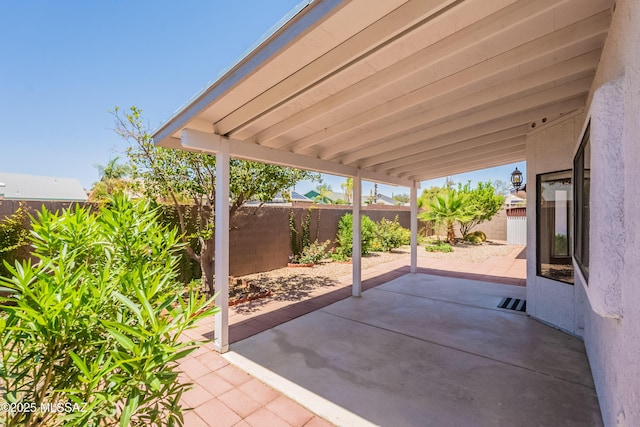9701 N Camino Del Fierro, Tucson, AZ 85742 - fenced backyard featuring a patio area