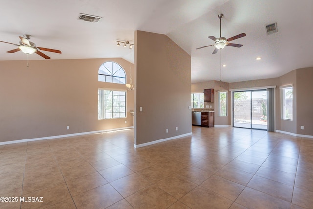 9701 N Camino Del Fierro, Tucson, AZ 85742 - unfurnished living room with a ceiling fan, plenty of natural light, baseboards, high vaulted ceiling, and recessed lighting