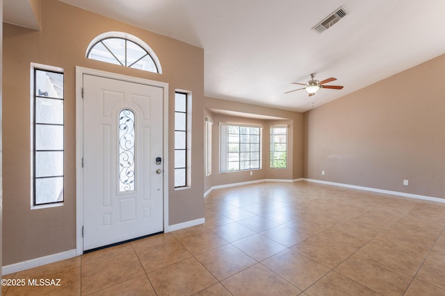 9701 N Camino Del Fierro, Tucson, AZ 85742 - entrance foyer featuring light tile patterned floors, lofted ceiling, a ceiling fan, and baseboards