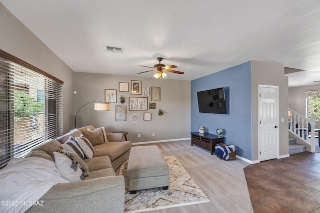 19 W Via Teresita, Sahuarita, AZ 85629 - living room featuring a ceiling fan, stairway, baseboards, and carpet floors