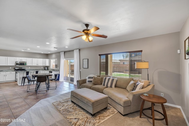 19 W Via Teresita, Sahuarita, AZ 85629 - living room with ceiling fan, baseboards, and recessed lighting
