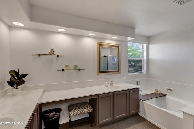 19 W Via Teresita, Sahuarita, AZ 85629 - bathroom with vanity, a bath, recessed lighting, and wood finished floors