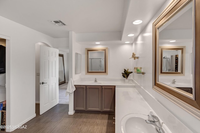 19 W Via Teresita, Sahuarita, AZ 85629 - full bathroom with double vanity, recessed lighting, and baseboards