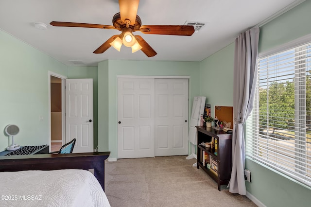 19 W Via Teresita, Sahuarita, AZ 85629 - bedroom featuring light colored carpet, a closet, a ceiling fan, and baseboards