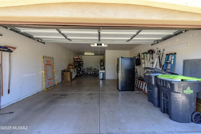 19 W Via Teresita, Sahuarita, AZ 85629 - garage featuring freestanding refrigerator and a garage door opener