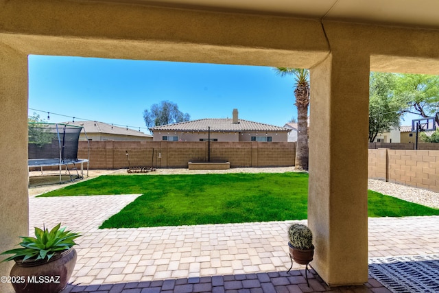 19 W Via Teresita, Sahuarita, AZ 85629 - view of yard with a trampoline and a patio