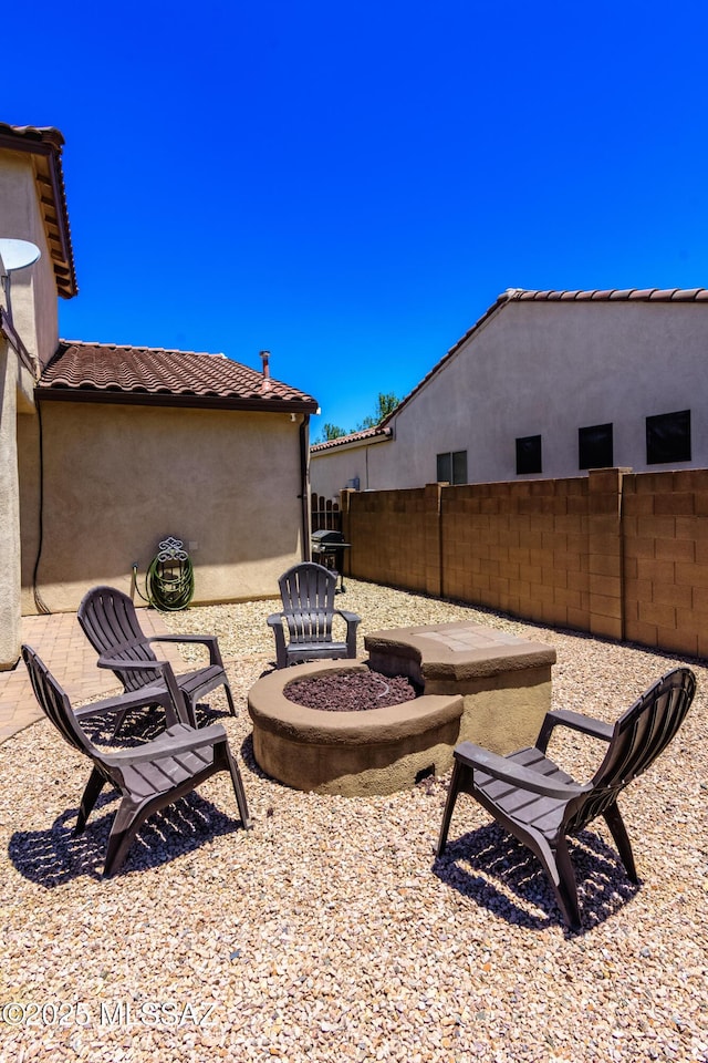 19 W Via Teresita, Sahuarita, AZ 85629 - view of patio / terrace with a fire pit