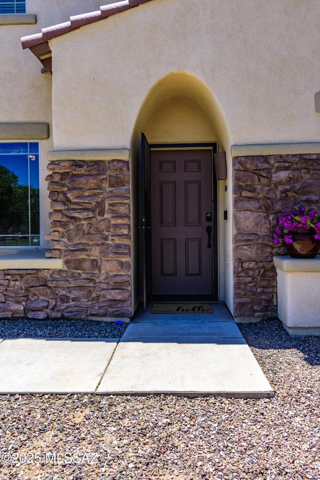 19 W Via Teresita, Sahuarita, AZ 85629 - view of exterior entry featuring stone siding and stucco siding