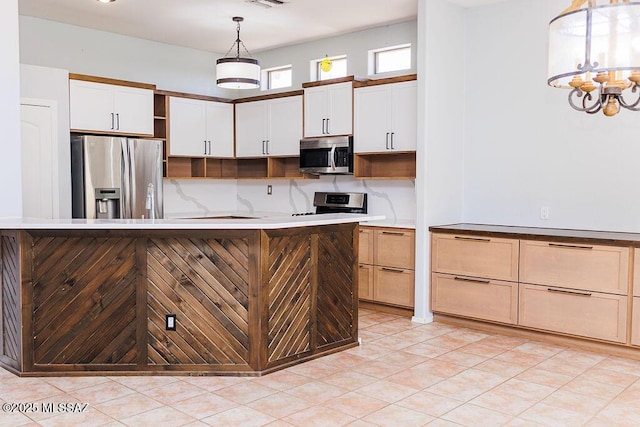 161 N Carlilse Way, Willcox, AZ 85643 - kitchen with stainless steel appliances, open shelves, pendant lighting, white cabinets, and light countertops