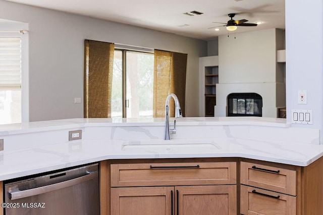 161 N Carlilse Way, Willcox, AZ 85643 - kitchen featuring stainless steel dishwasher, a sink, light stone counters, and ceiling fan