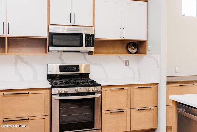 161 N Carlilse Way, Willcox, AZ 85643 - kitchen featuring appliances with stainless steel finishes, open shelves, light stone counters, and tasteful backsplash