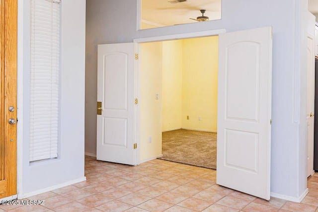161 N Carlilse Way, Willcox, AZ 85643 - unfurnished bedroom with light colored carpet, baseboards, and light tile patterned flooring