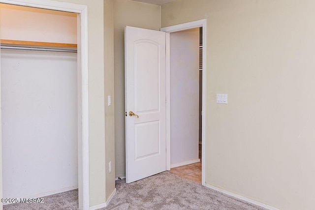 161 N Carlilse Way, Willcox, AZ 85643 - unfurnished bedroom with carpet flooring, a closet, and baseboards