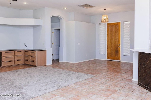 161 N Carlilse Way, Willcox, AZ 85643 - kitchen with arched walkways, pendant lighting, baseboards, recessed lighting, and light tile patterned floors