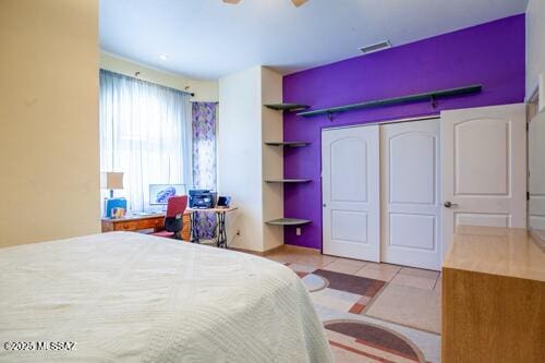 480 Camino Ramanote, Rio Rico, AZ 85648 - tiled bedroom with a closet and a ceiling fan