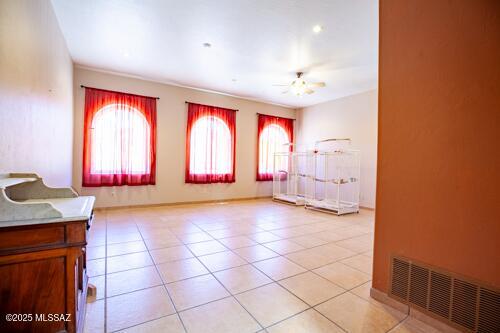 480 Camino Ramanote, Rio Rico, AZ 85648 - entrance foyer featuring healthy amount of natural light, ceiling fan, and light tile patterned flooring