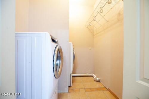 480 Camino Ramanote, Rio Rico, AZ 85648 - washroom with light tile patterned floors and washer / clothes dryer