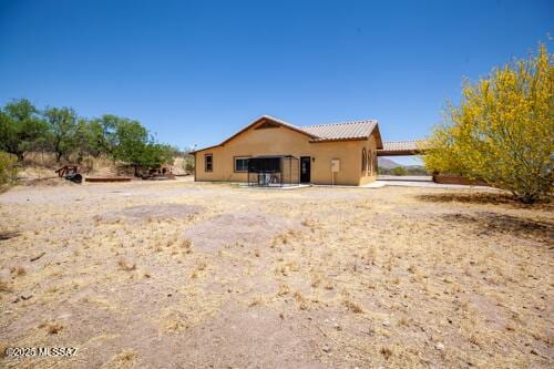 480 Camino Ramanote, Rio Rico, AZ 85648 - rear view of property featuring a tile roof and stucco siding