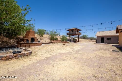 480 Camino Ramanote, Rio Rico, AZ 85648 - view of yard featuring exterior fireplace