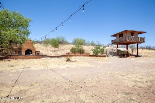 480 Camino Ramanote, Rio Rico, AZ 85648 - view of yard with an outdoor fireplace